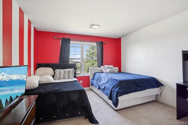 a bathroom with a granite countertop sink mirror and toilet
