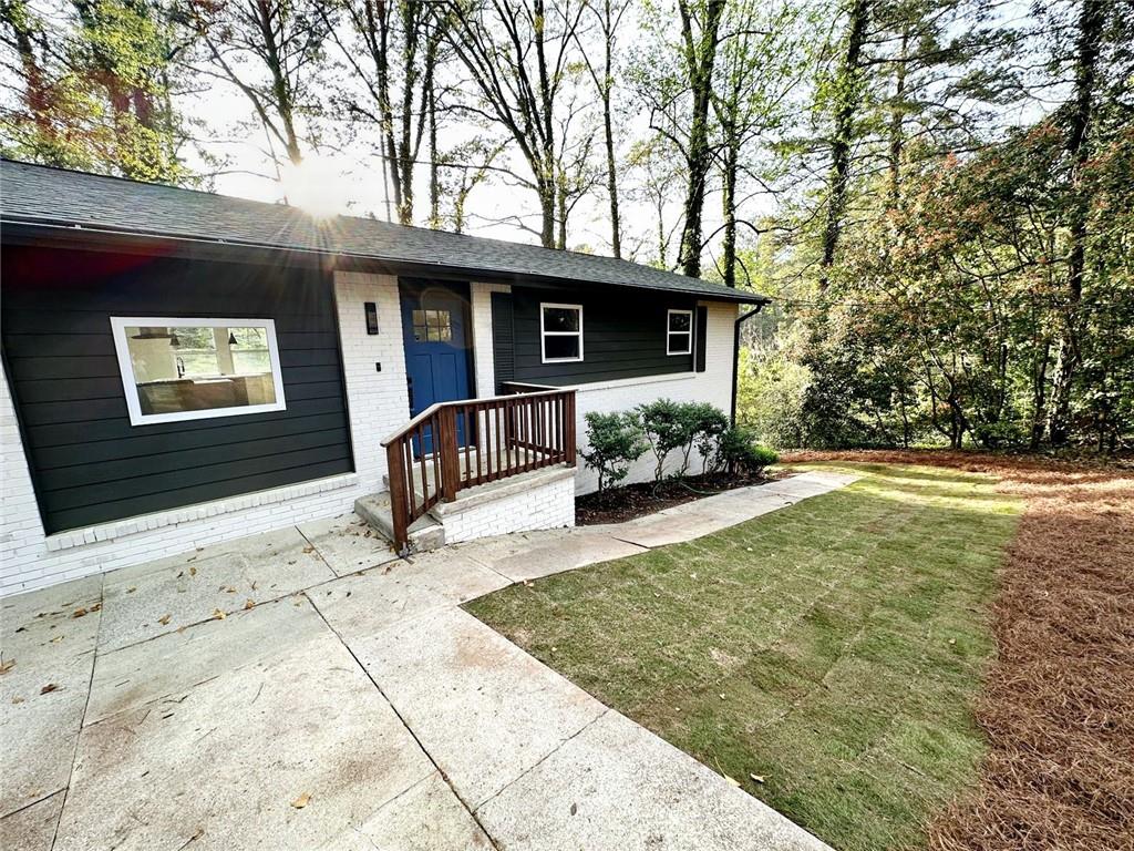 a front view of a house with garden