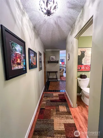 a view of a hallway with a livingroom