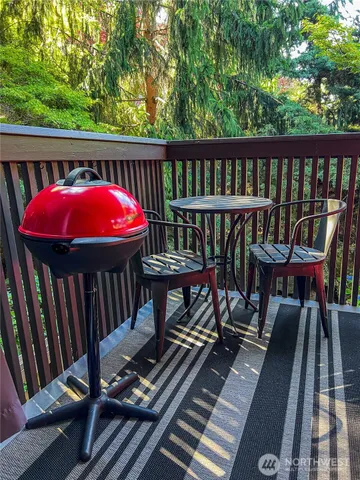a view of a balcony with furniture