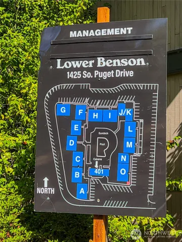 a front view of a building with parking