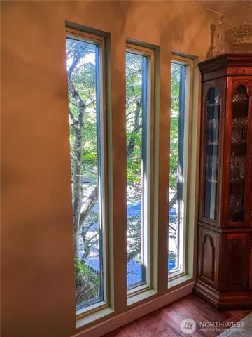 a view of an entryway with wooden floor