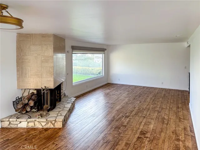 a living room with hard wood floors and a couch