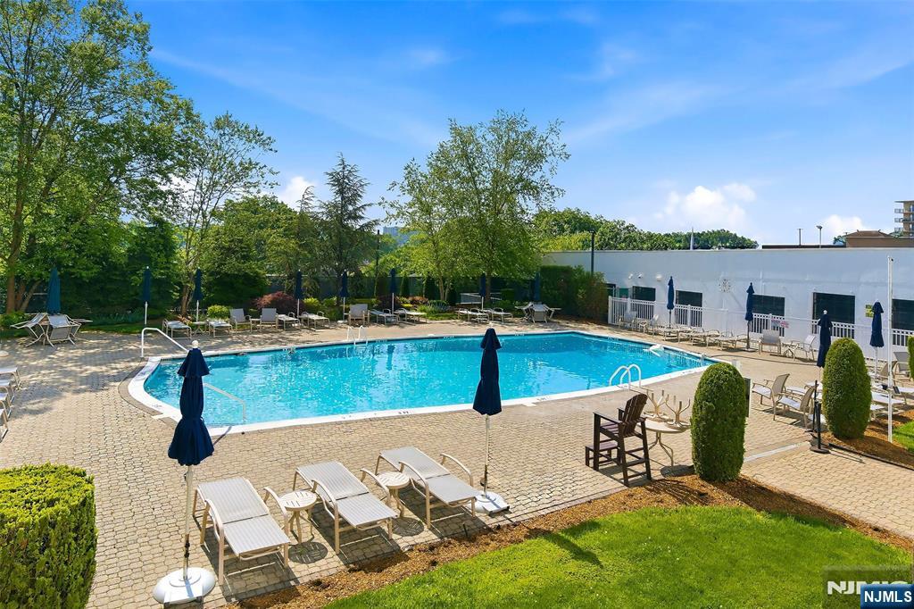 280 Prospect Avenue, Unit 8G Hackensack, NJ 07601 - Photo 19 of 23 a view of a patio with swimming pool