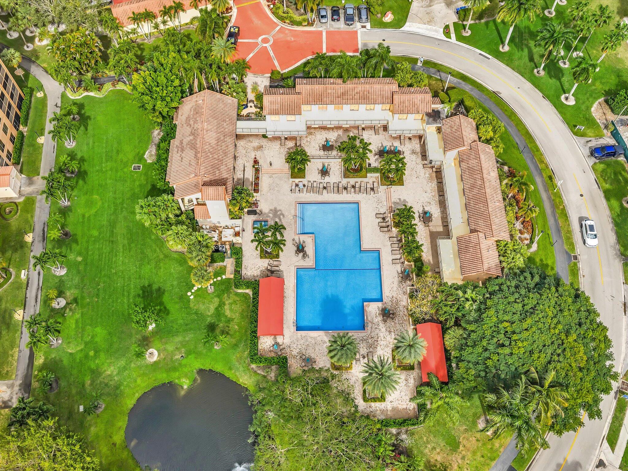 7201 Promenade Drive, Unit 602 Boca Raton, FL 33433 - Photo 16 of 77 an aerial view of a house with a yard and garden