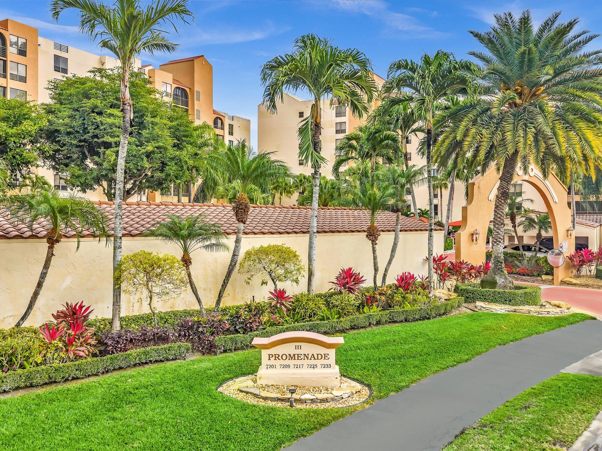 7201 Promenade Drive, Unit 602 Boca Raton, FL 33433 - Photo 18 of 77 a front view of multi story residential apartment building with yard and sign board