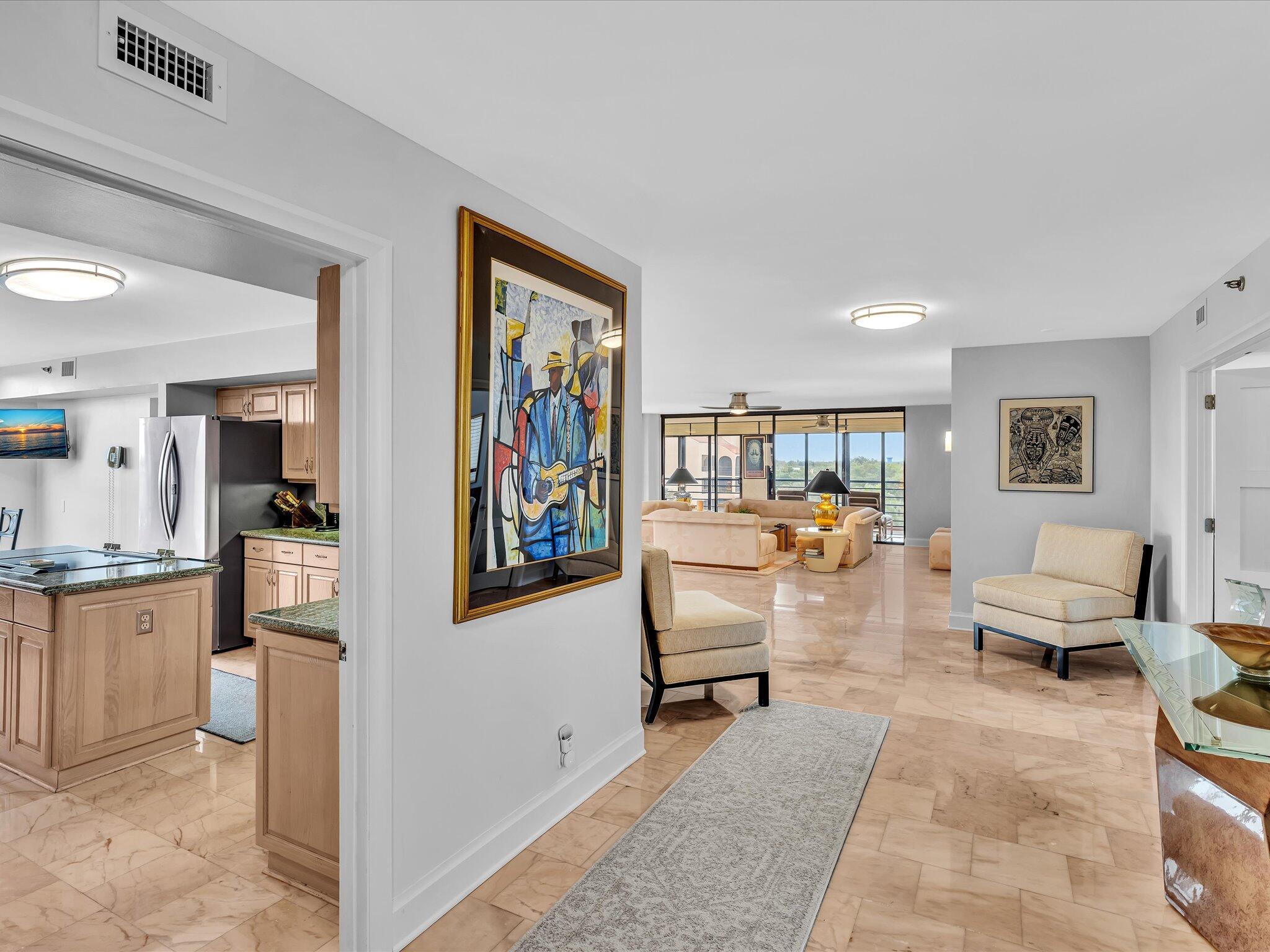 7201 Promenade Drive, Unit 602 Boca Raton, FL 33433 - Photo 24 of 77 a living room with furniture and a flat screen tv