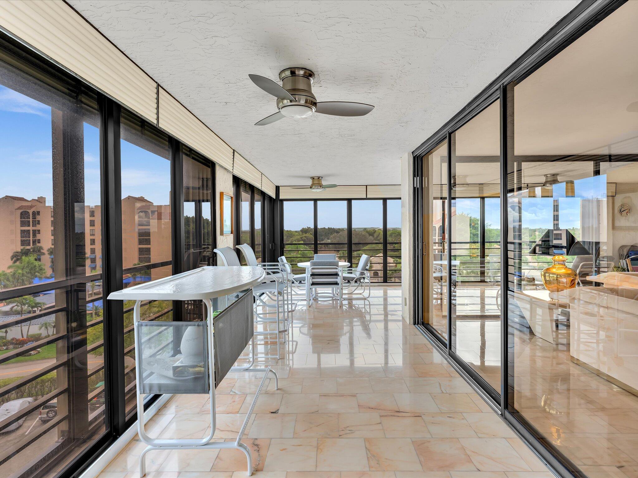 7201 Promenade Drive, Unit 602 Boca Raton, FL 33433 - Photo 30 of 77 a view of a dining hall with large windows