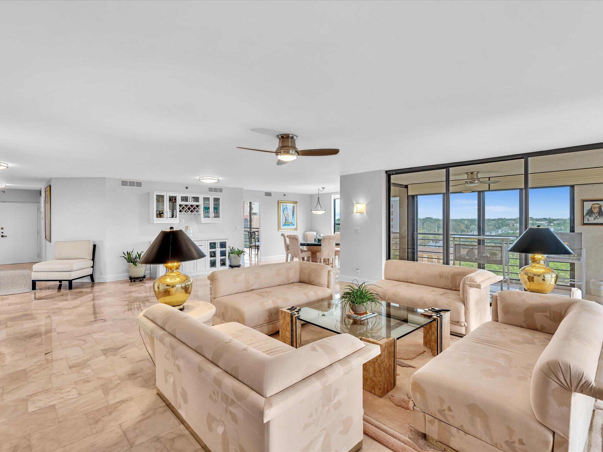7201 Promenade Drive, Unit 602 Boca Raton, FL 33433 - Photo 3 of 77 a living room with furniture and a large window