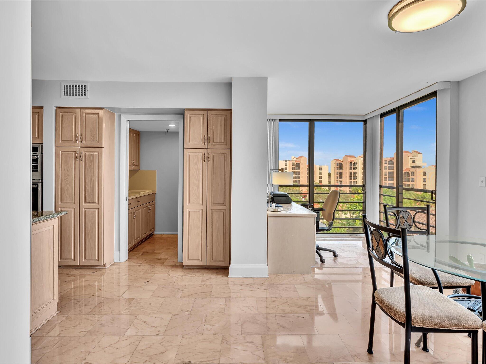 7201 Promenade Drive, Unit 602 Boca Raton, FL 33433 - Photo 36 of 77 a view of a livingroom with furniture and floor to ceiling window