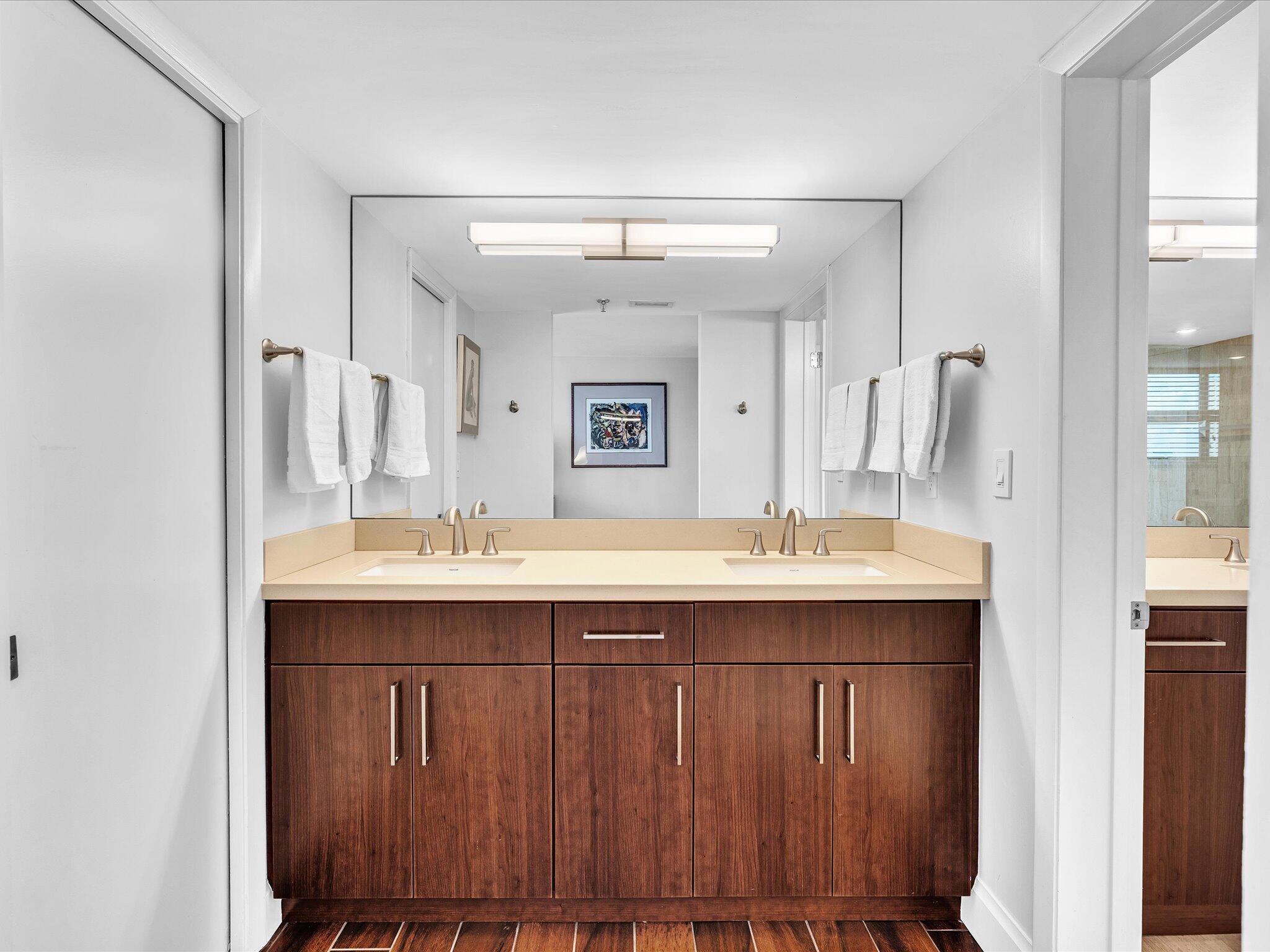 7201 Promenade Drive, Unit 602 Boca Raton, FL 33433 - Photo 52 of 77 a bathroom with a sink and a mirror