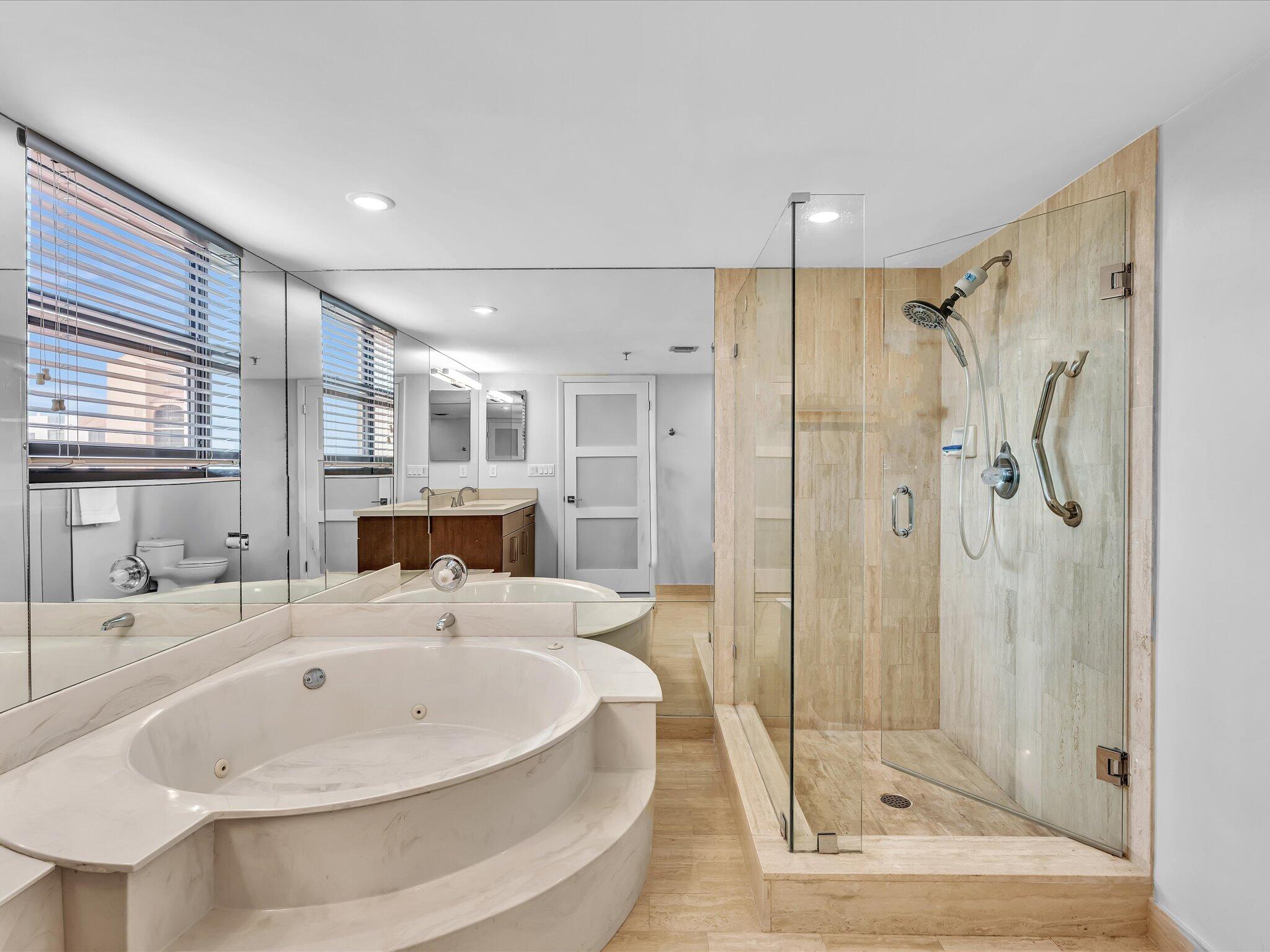 7201 Promenade Drive, Unit 602 Boca Raton, FL 33433 - Photo 53 of 77 a bathroom with a bathtub and a shower