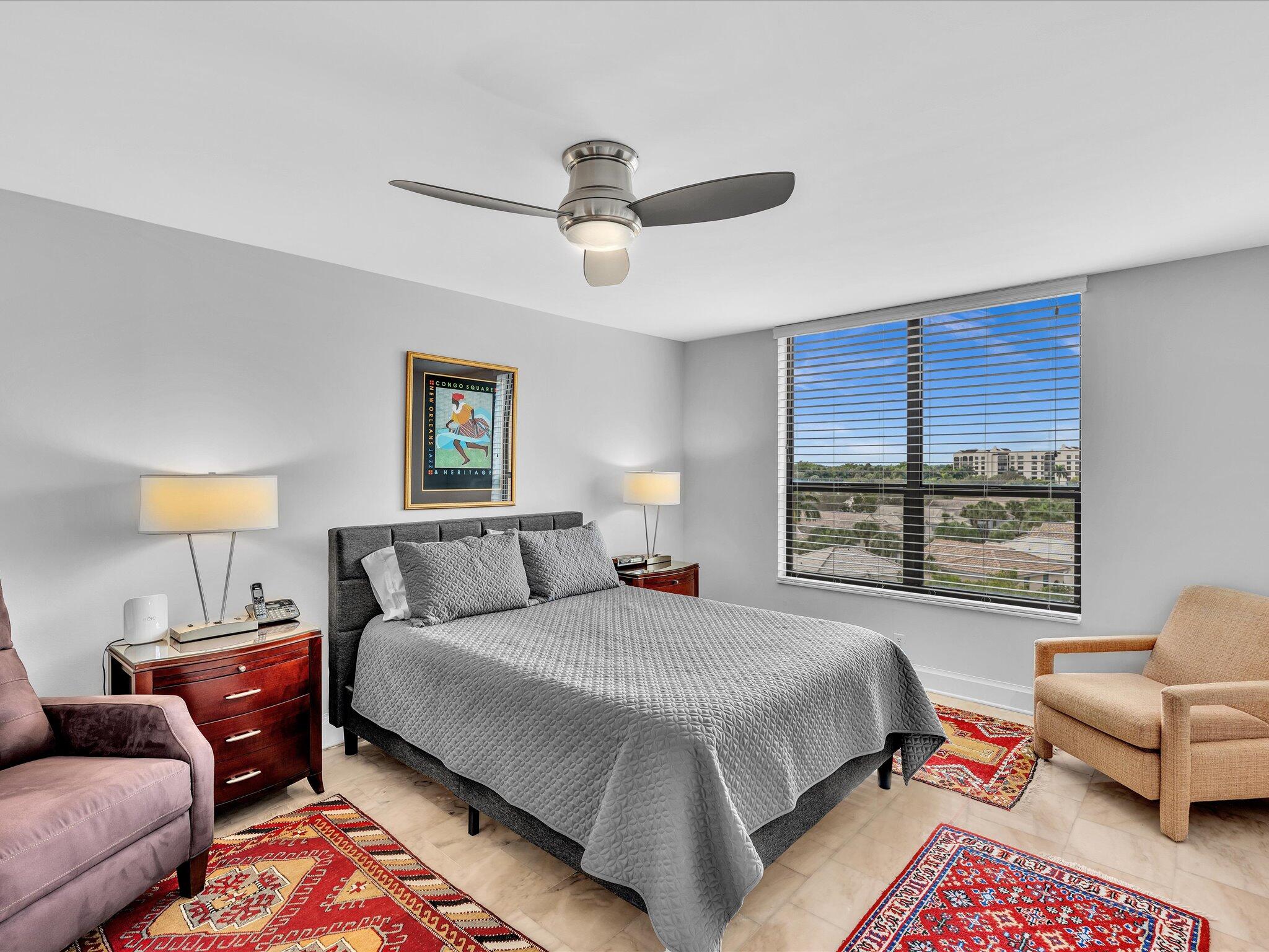 7201 Promenade Drive, Unit 602 Boca Raton, FL 33433 - Photo 56 of 77 a bedroom with a bed and a couch
