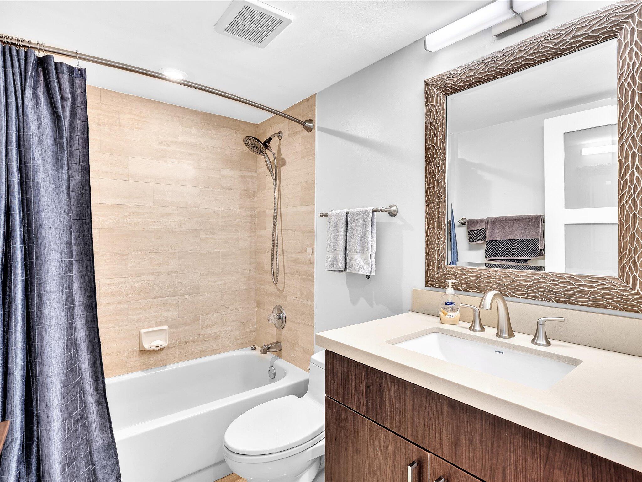 7201 Promenade Drive, Unit 602 Boca Raton, FL 33433 - Photo 58 of 77 a bathroom with a granite countertop sink toilet and shower