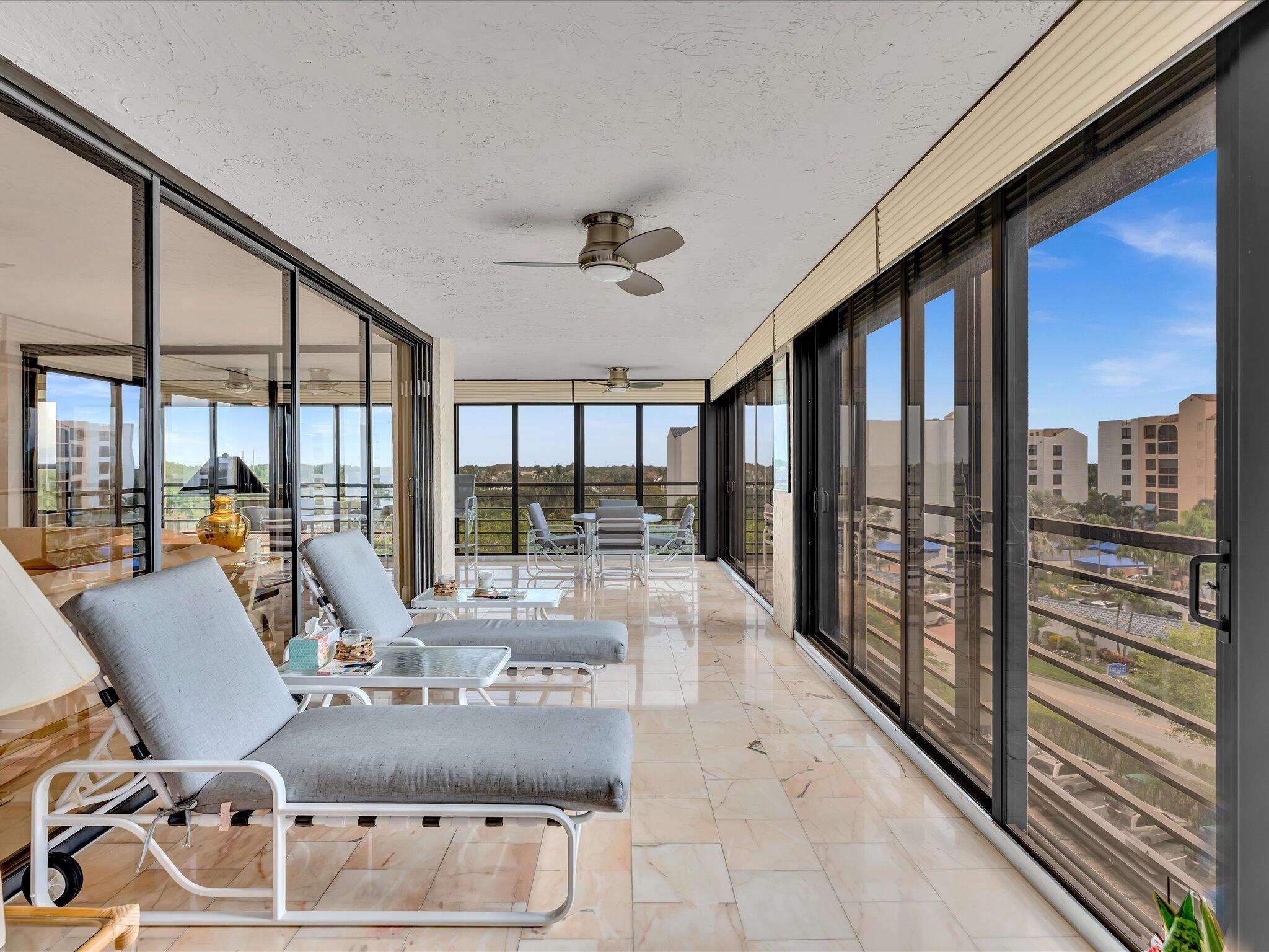 7201 Promenade Drive, Unit 602 Boca Raton, FL 33433 - Photo 7 of 77 a view of a dining room with furniture water view and a floor to ceiling window