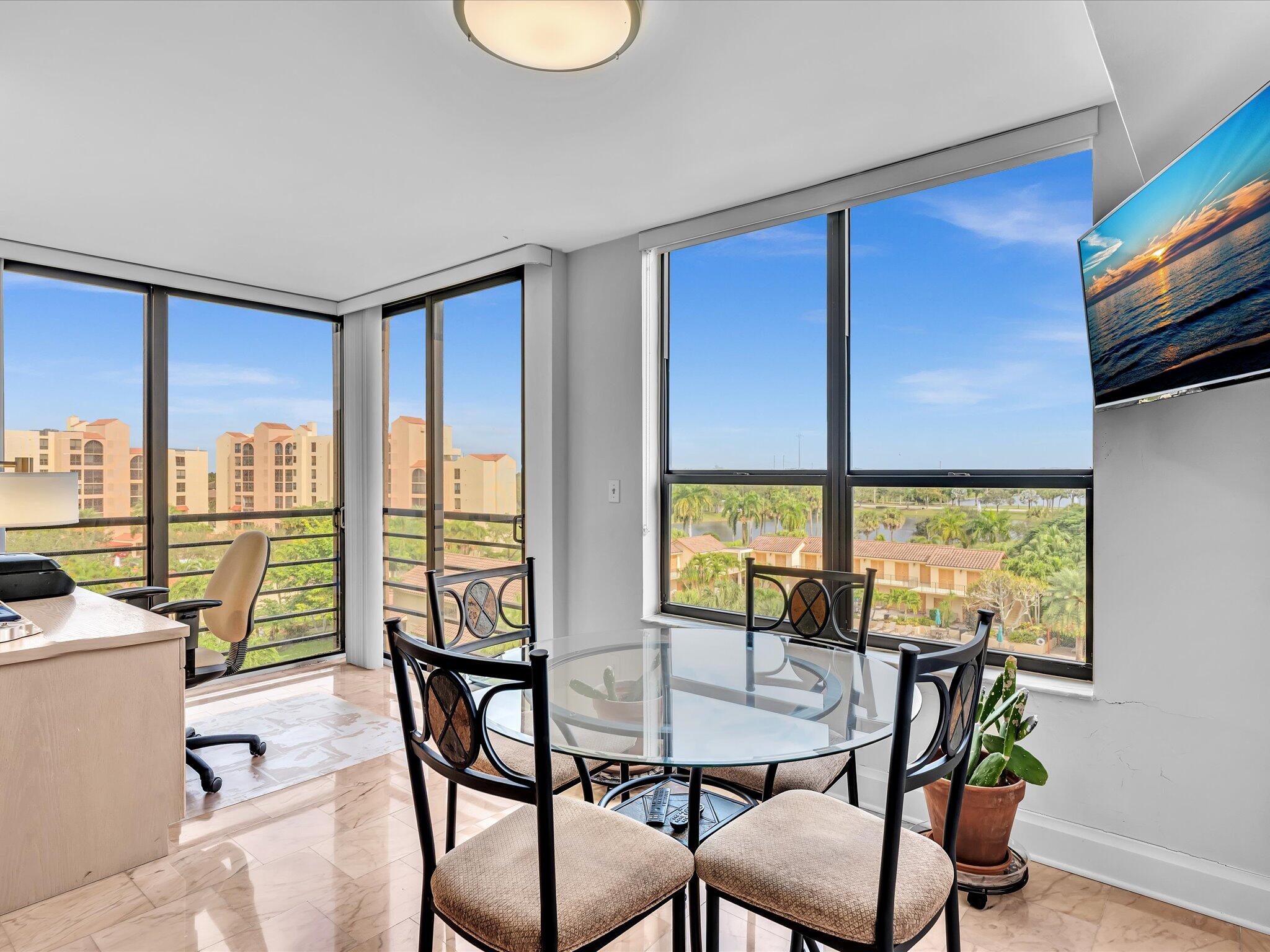 7201 Promenade Drive, Unit 602 Boca Raton, FL 33433 - Photo 8 of 77 a view of a dining room with furniture window and outside view