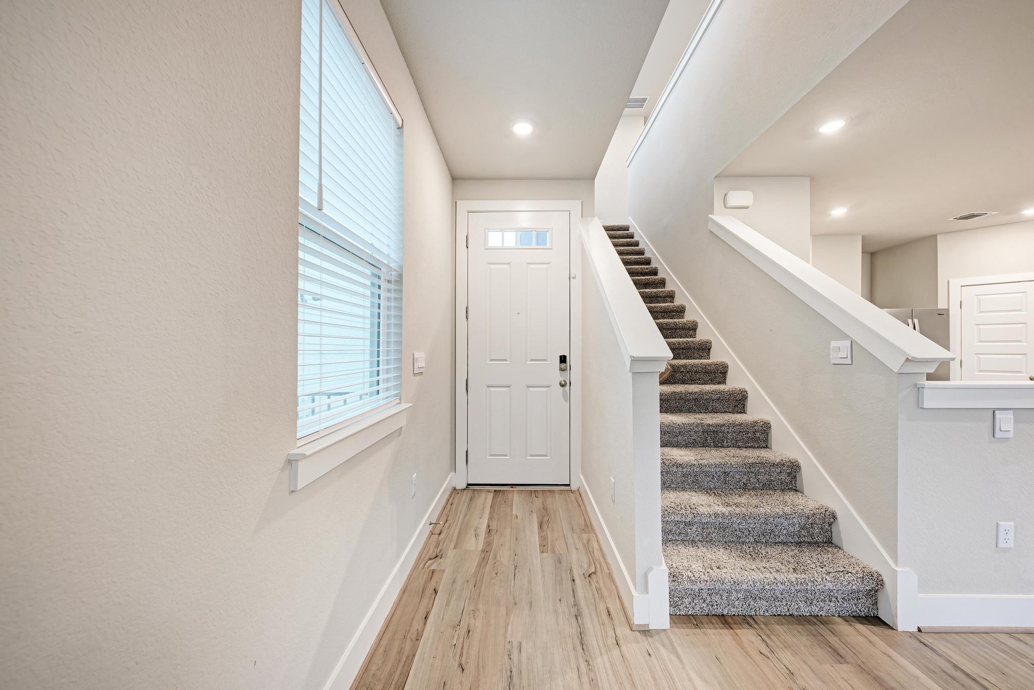 7319 Travertine Spring Drive, Unit 115 Austin, TX 78744 - Photo 12 of 37 a view of an entryway with wooden floor