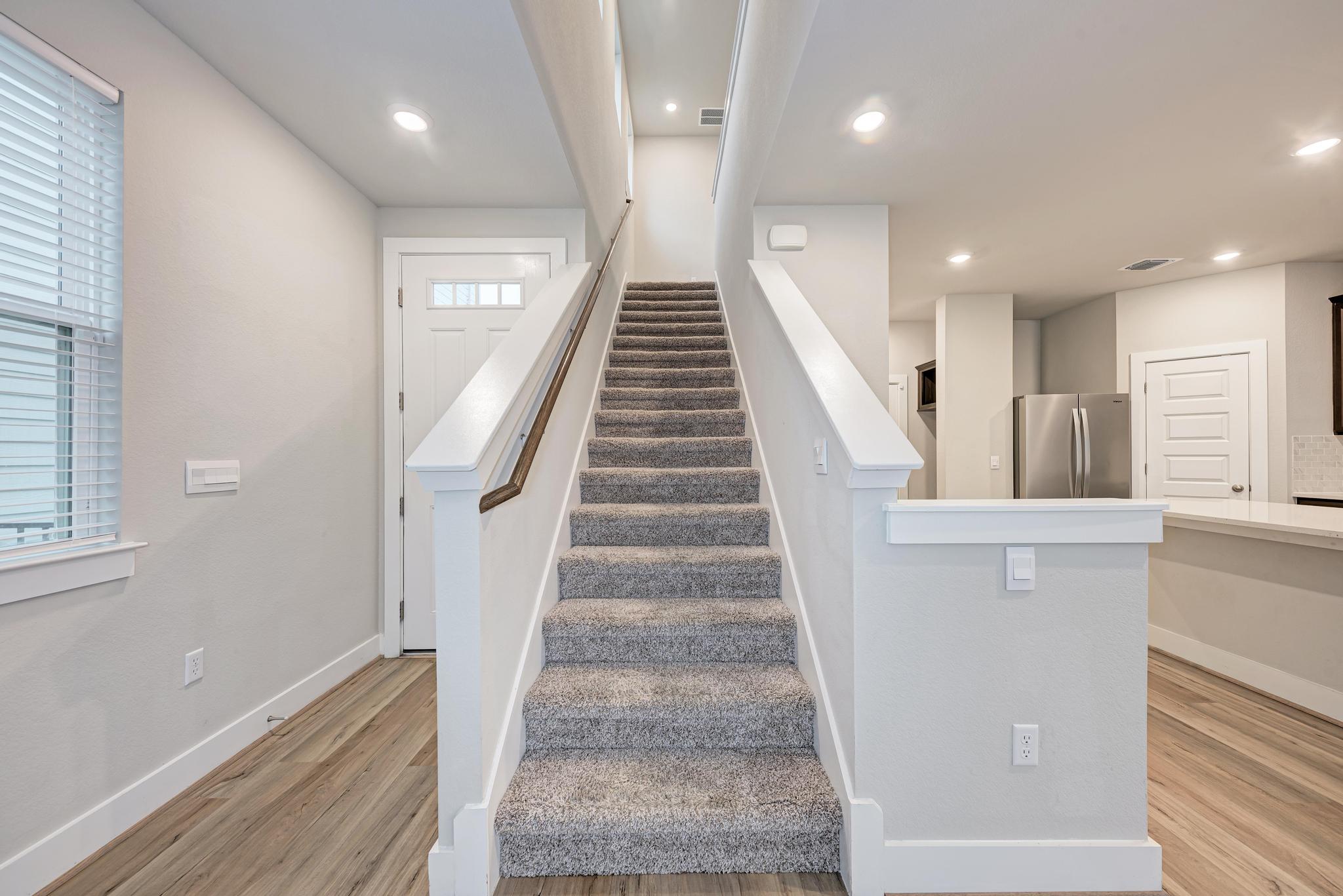 7319 Travertine Spring Drive, Unit 115 Austin, TX 78744 - Photo 24 of 37 a view of entryway and hall with wooden floor