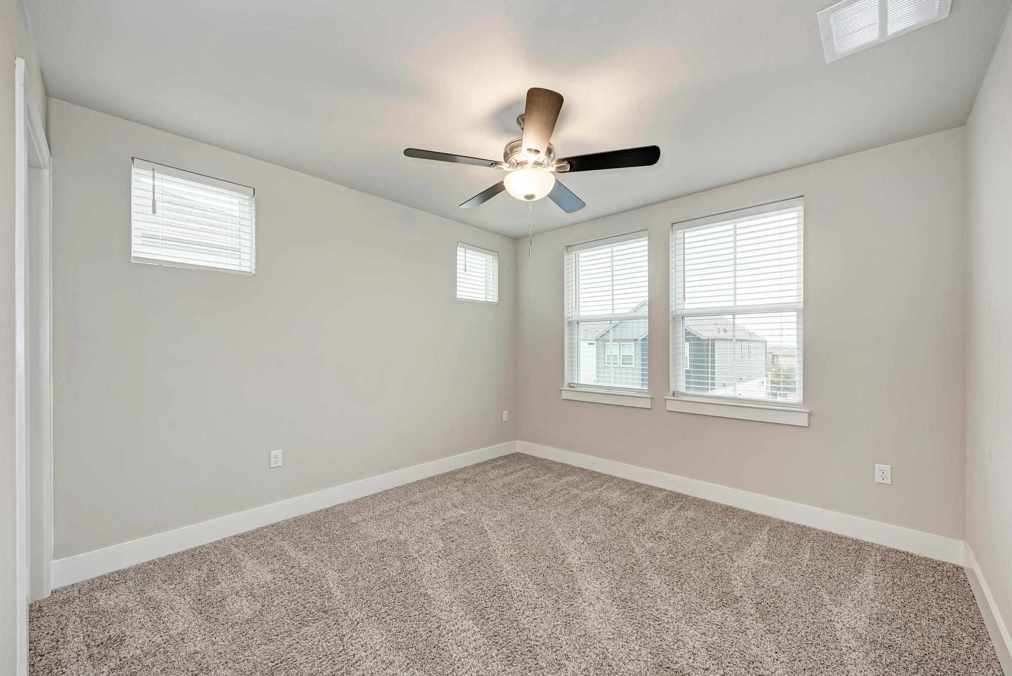 7319 Travertine Spring Drive, Unit 115 Austin, TX 78744 - Photo 27 of 37 a view of an empty room with a window