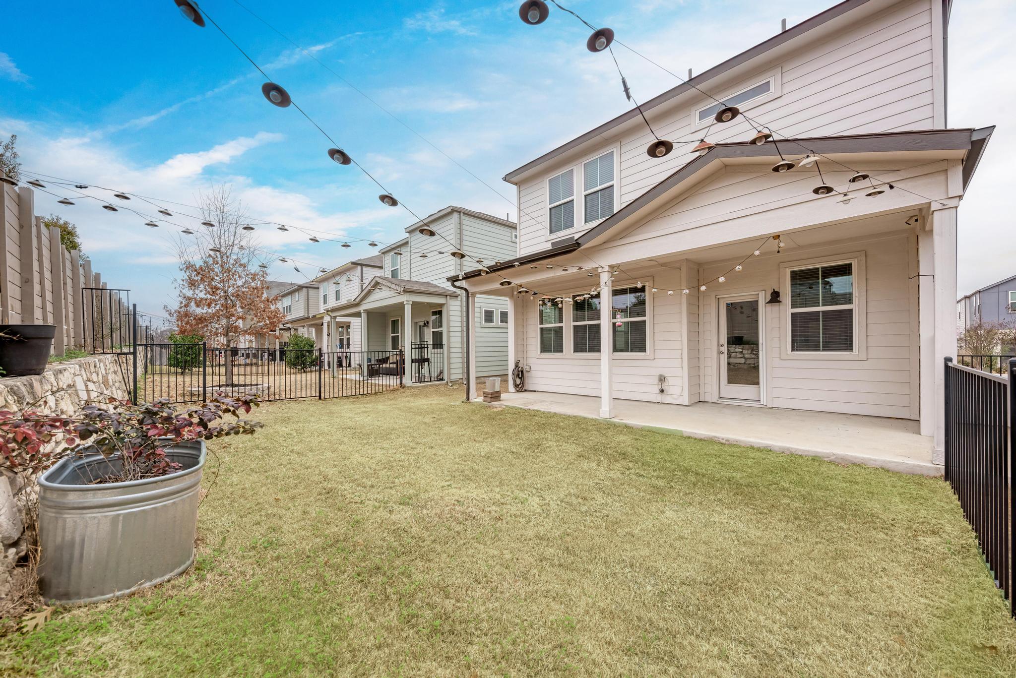 7319 Travertine Spring Drive, Unit 115 Austin, TX 78744 - Photo 8 of 37 a view of a house with a patio