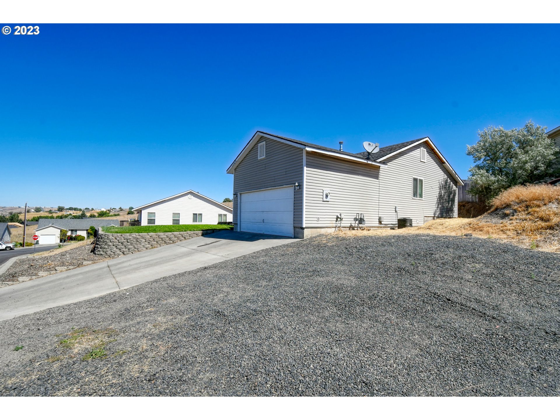 1306 Southwest 11th Court Pendleton, OR 97801 - Photo 3 of 27 a view of a house with a yard