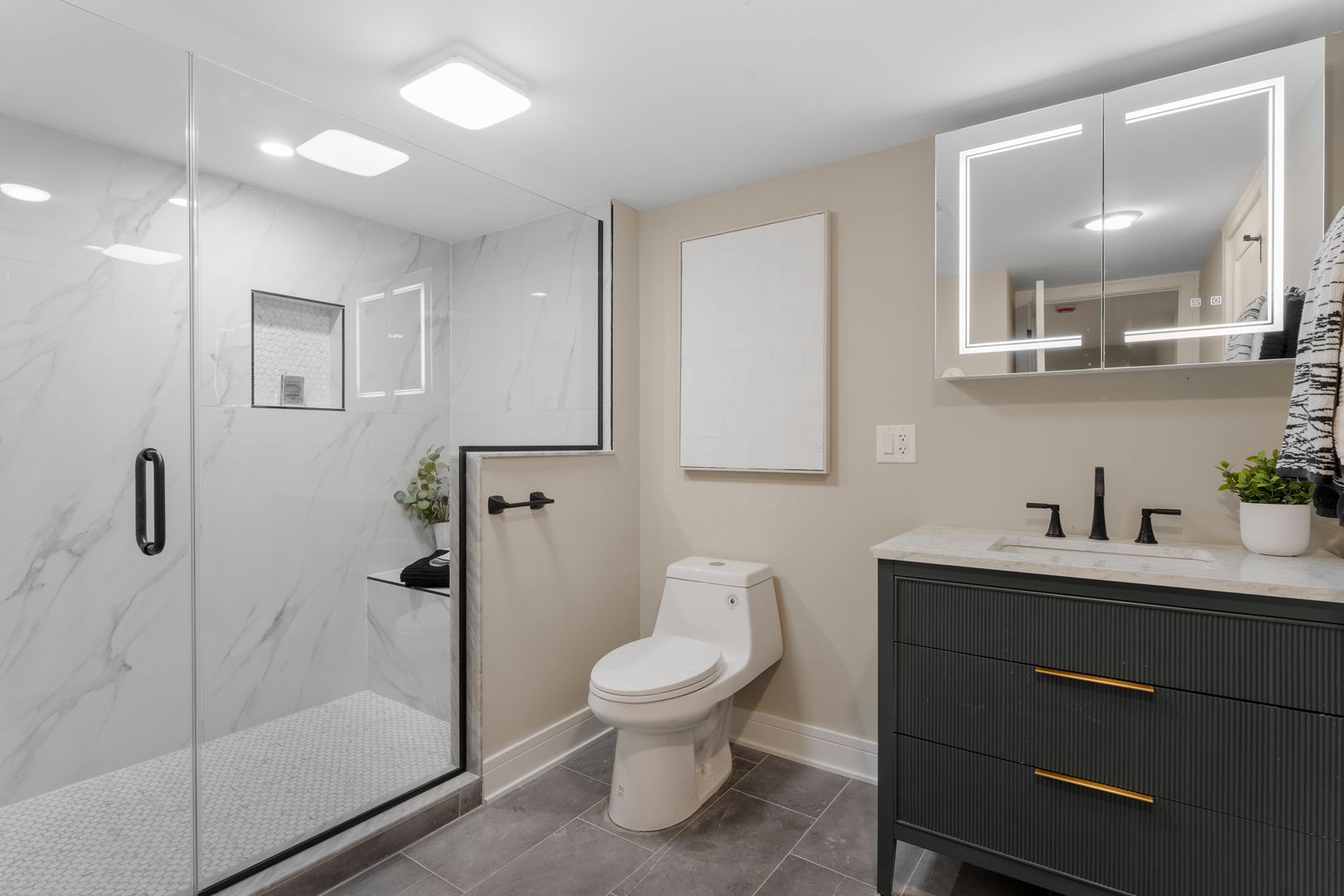 8549 South Indiana Avenue Chicago, IL 60619 - Photo 21 of 28 a bathroom with a toilet a sink a mirror and shower