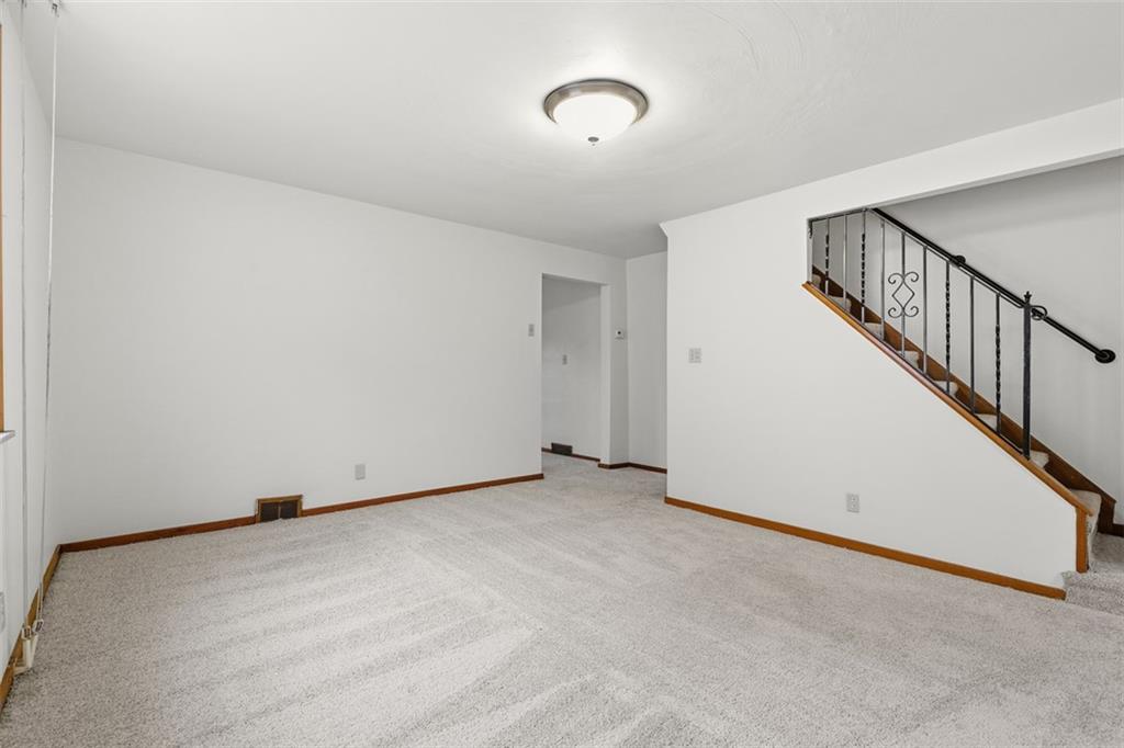 528 9th Street Pitcairn, PA 15140 - Photo 12 of 38 a view of an empty room with wooden floor
