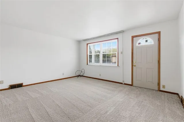 an empty room with a bench