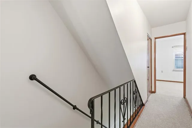 a bathroom with a toilet sink and shower