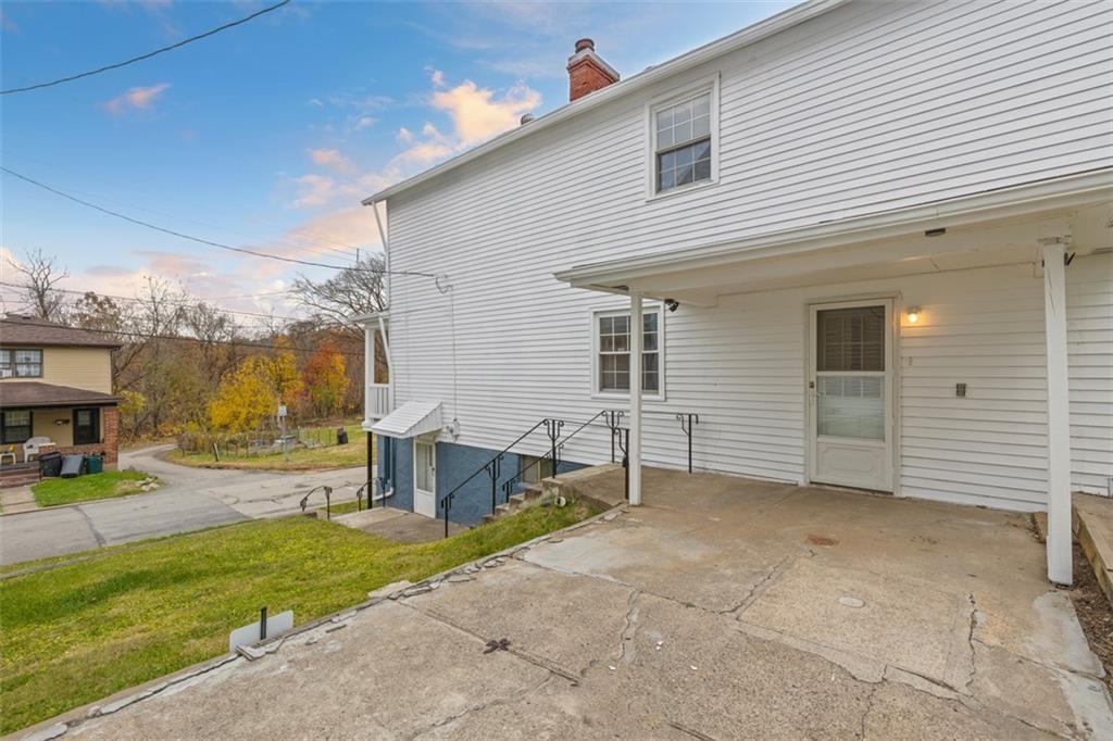 528 9th Street Pitcairn, PA 15140 - Photo 32 of 38 a backyard of a house with a yard and outdoor seating