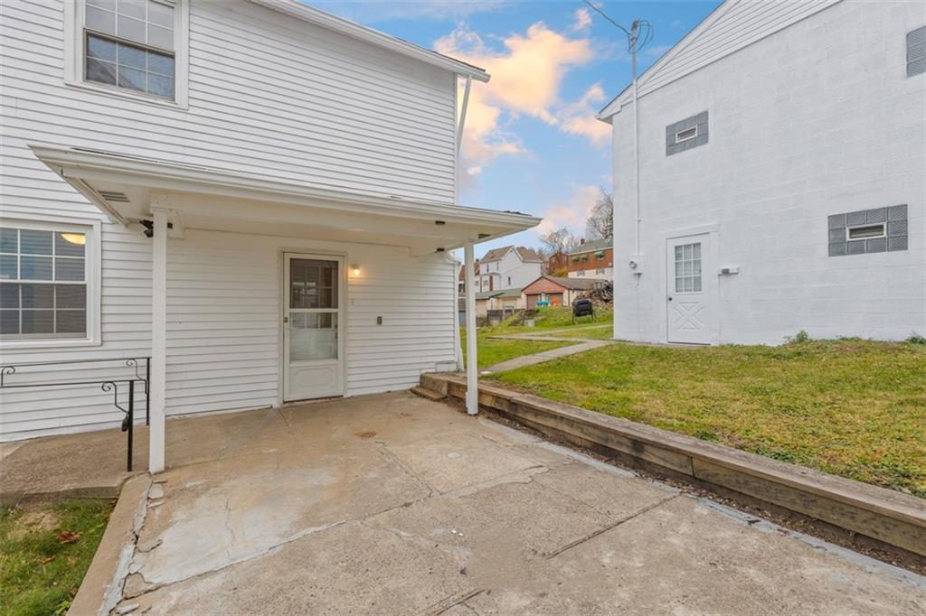 528 9th Street Pitcairn, PA 15140 - Photo 33 of 38 a view of a patio with a table and chairs and potted plants