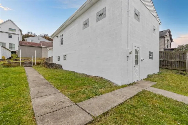 a view of a backyard of the house