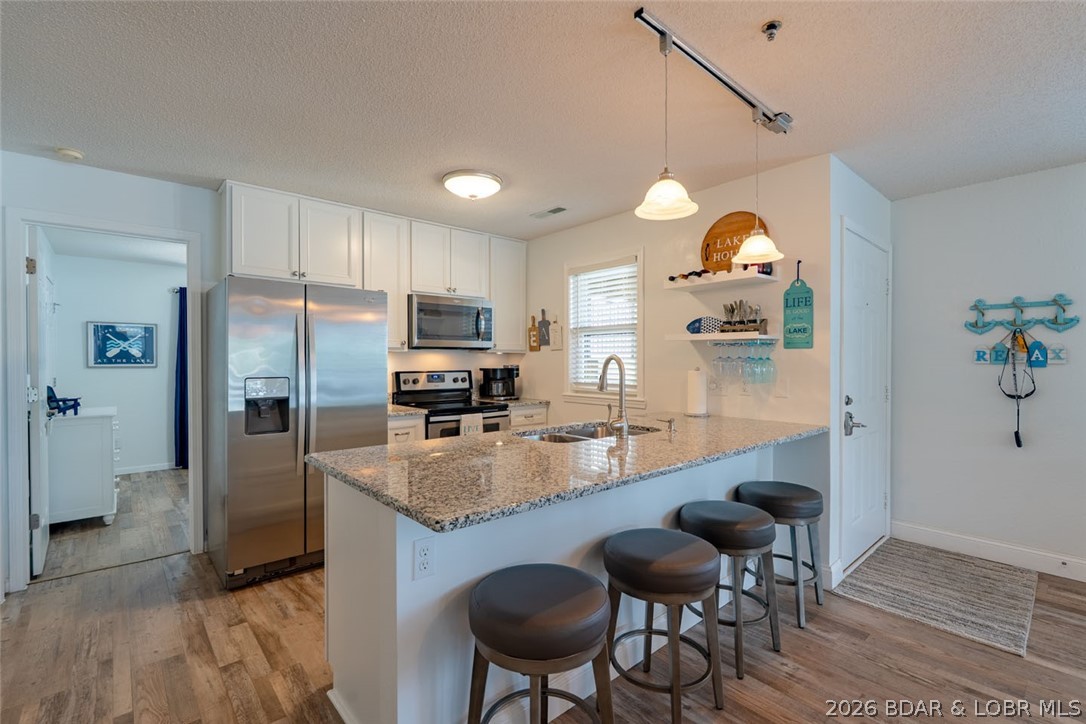 88 Willow Ridge Point, Unit 2A Lake Ozark, MO 65049 - Photo 12 of 61 Updated Kitchen with newer cabintry, newer applian