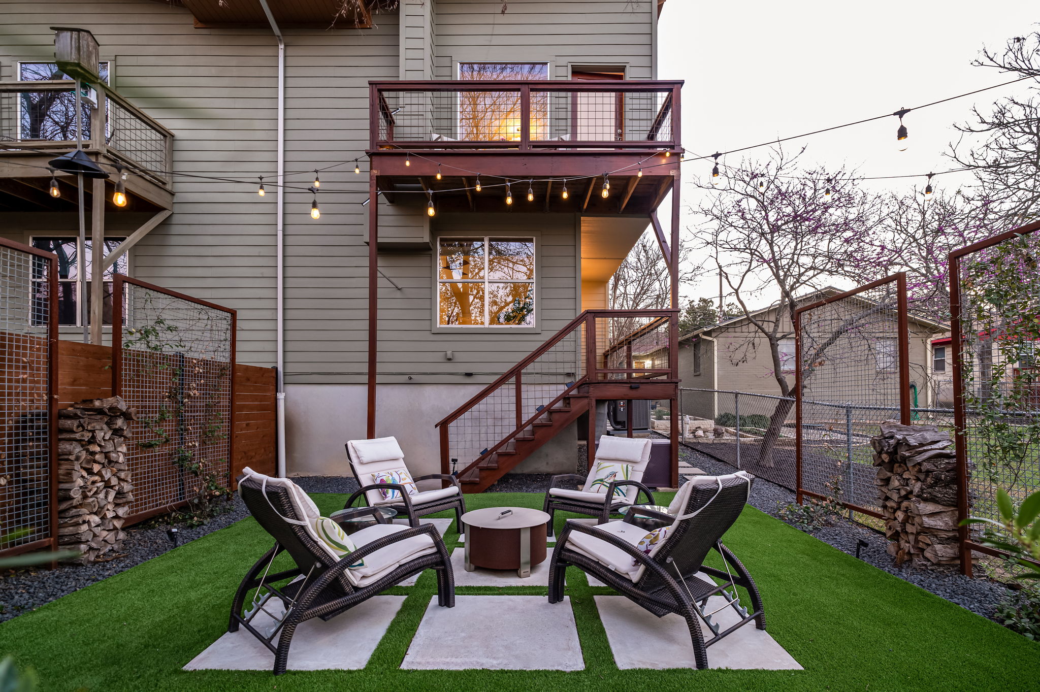 1700 Ravey Street, Unit A Austin, TX 78704 - Photo 22 of 40 Rear view of house featuring an outdoor fire pit, a fenced backyard, a balcony, and a patio