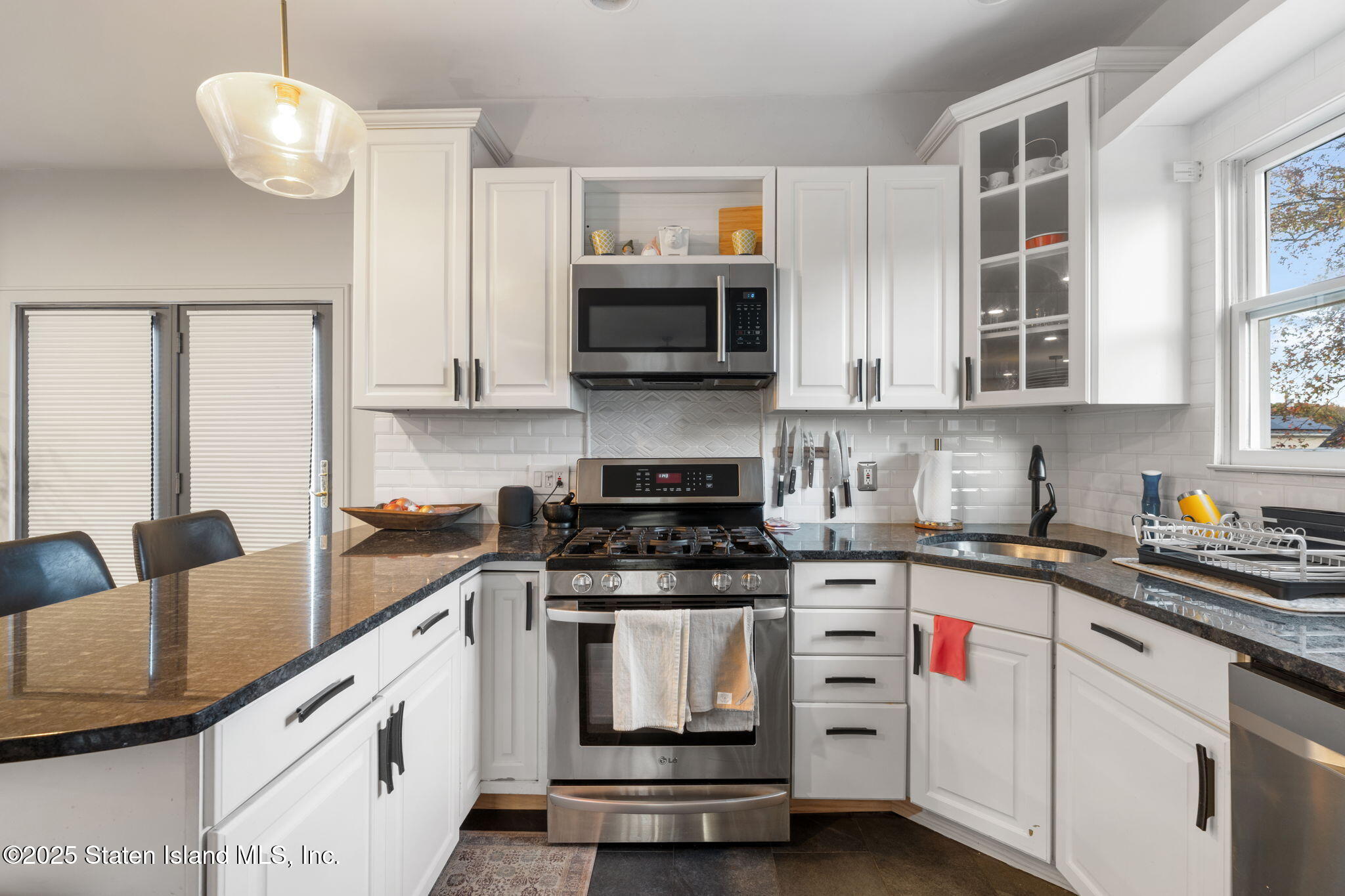 6 Mosely Avenue Staten Island, NY 10312 - Photo 17 of 55 a kitchen with stainless steel appliances granite countertop a stove and cabinets