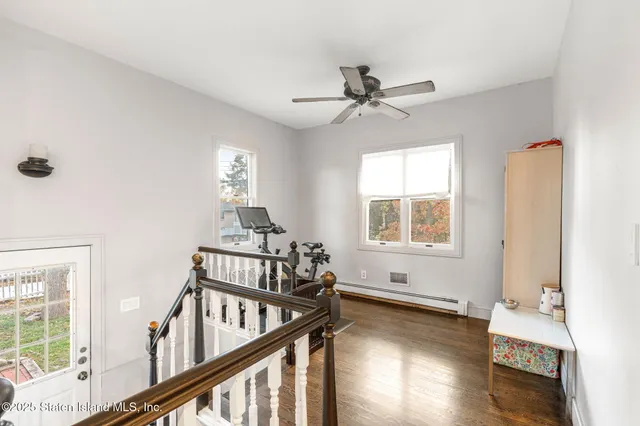 a view of living room with furniture and floor to ceiling window