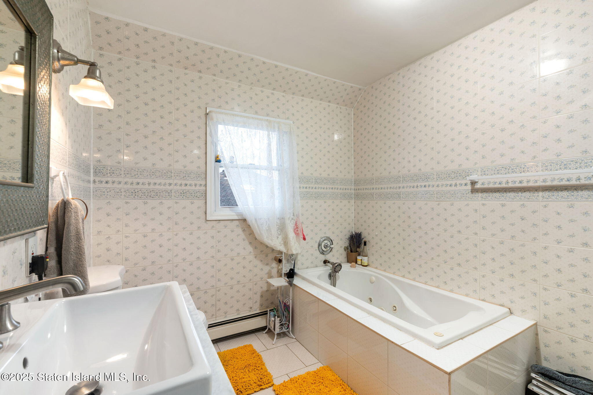 6 Mosely Avenue Staten Island, NY 10312 - Photo 23 of 55 a bathroom with a sink and a bathtub