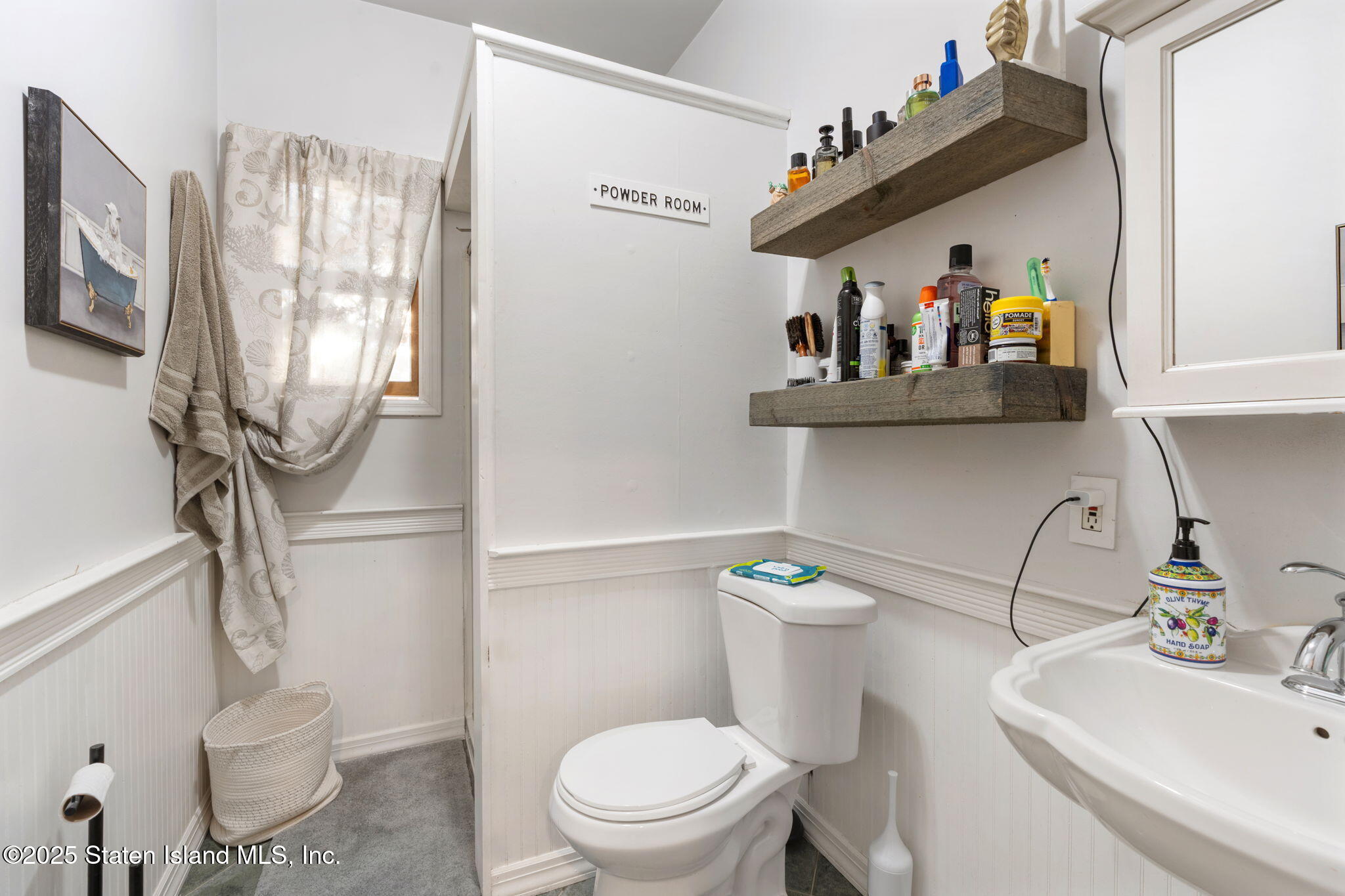 6 Mosely Avenue Staten Island, NY 10312 - Photo 24 of 55 a bathroom with a sink a toilet and a mirror