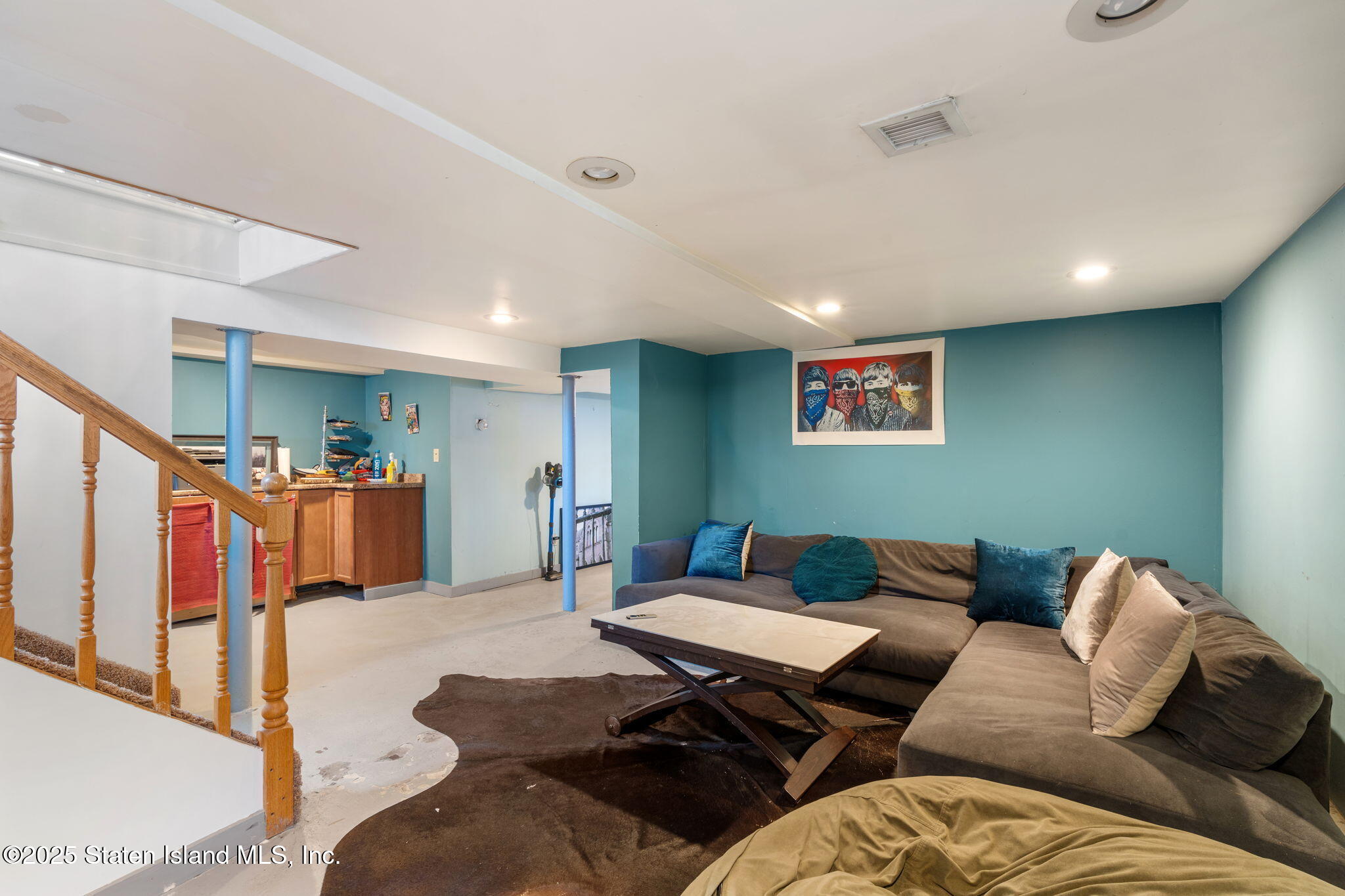 6 Mosely Avenue Staten Island, NY 10312 - Photo 36 of 55 a living room with furniture kitchen view and a wooden floor