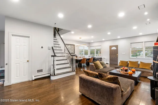 a dining table with chairs and window
