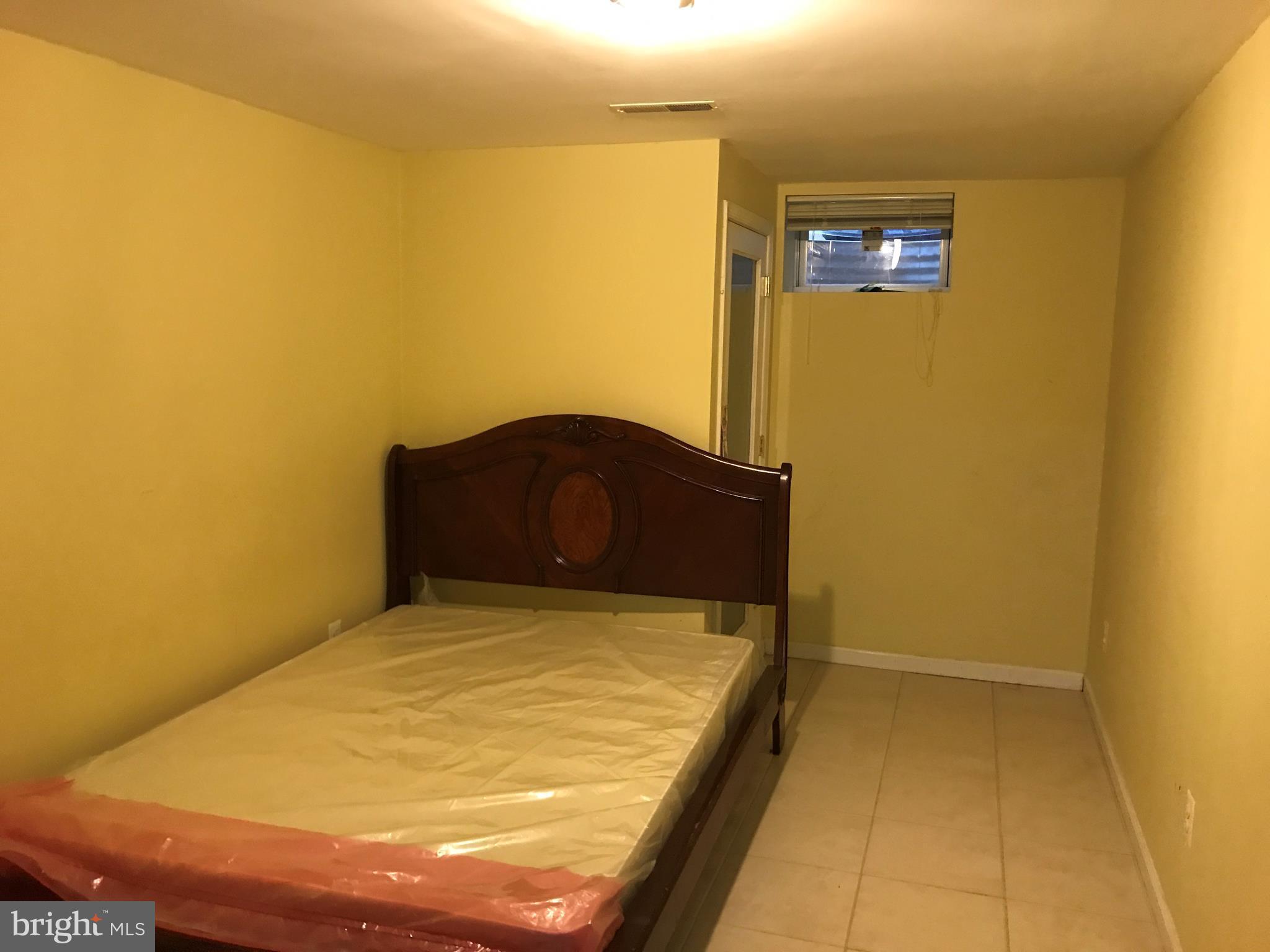 14731 Good Hope Road Silver Spring, MD 20905 - Photo 27 of 30 a room with a bed