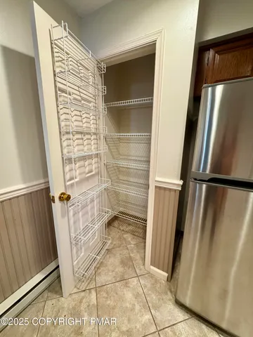 a bathroom with a shower and a sink