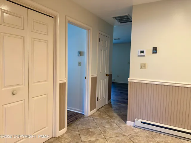 a view of a hallway with closet area