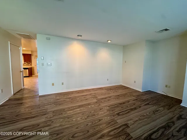 a view of room and wooden floor