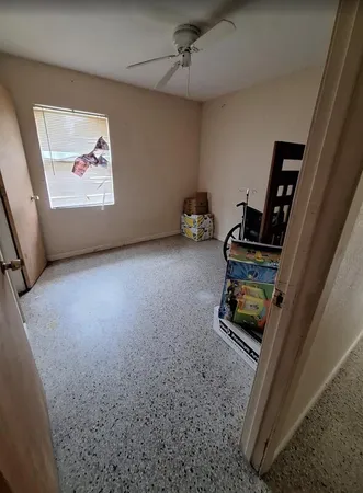 a view of an empty room with windows