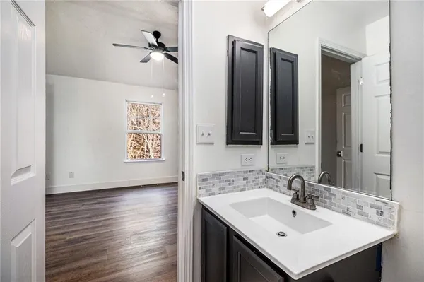 a bathroom with a sink and a mirror