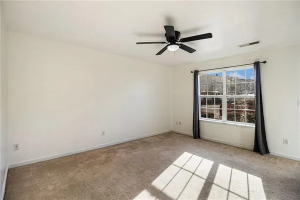 a view of empty room with windows