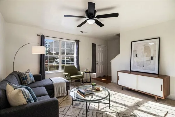 a living room with furniture and a window