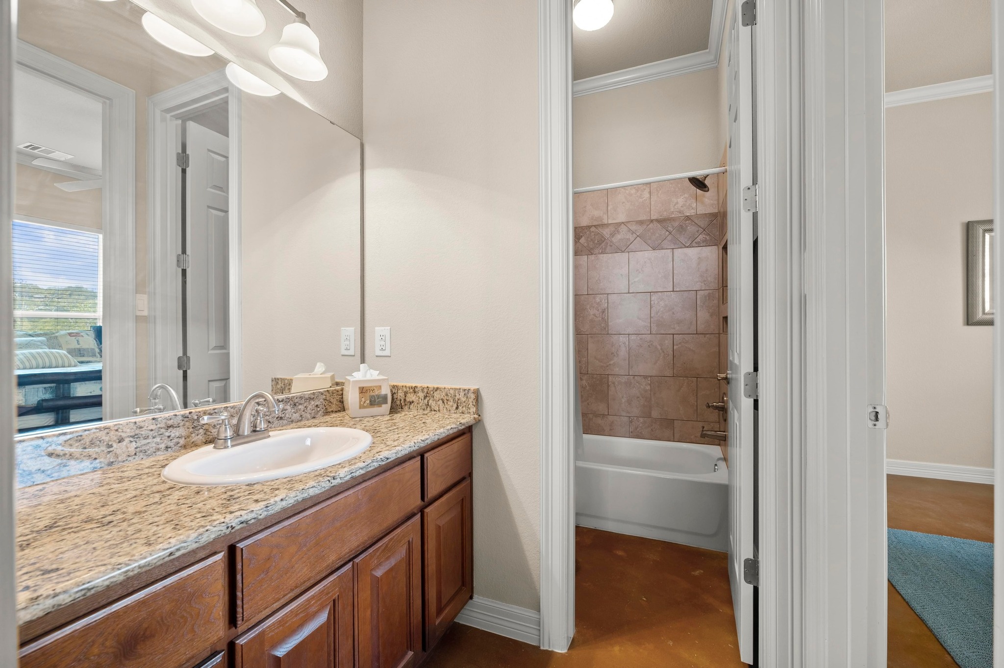 28701 Valley Road Marble Falls, TX 78654 - Photo 19 of 35 a bathroom with a granite countertop sink and a mirror
