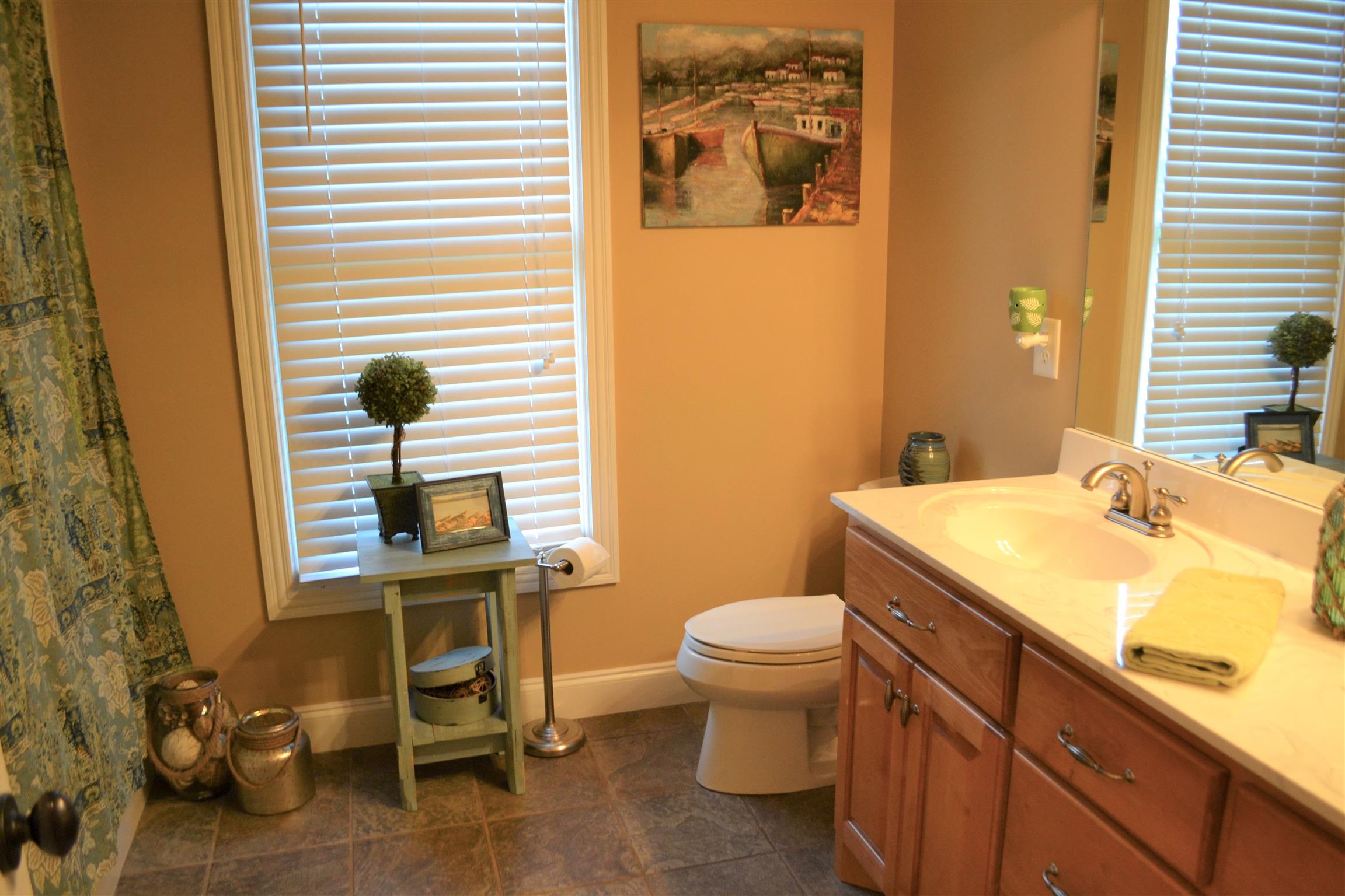 730 Walnut Grove Road Lebanon, TN 37090 - Photo 10 of 29 HALL BATH HAS CUSTOM VANITY WITH MARBLE TOP AND TILE FLOORS; TUB/SHOWER COMBO